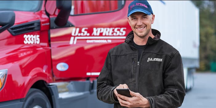 U.S. Xpress driver utilizing his mobile app to review the load table.