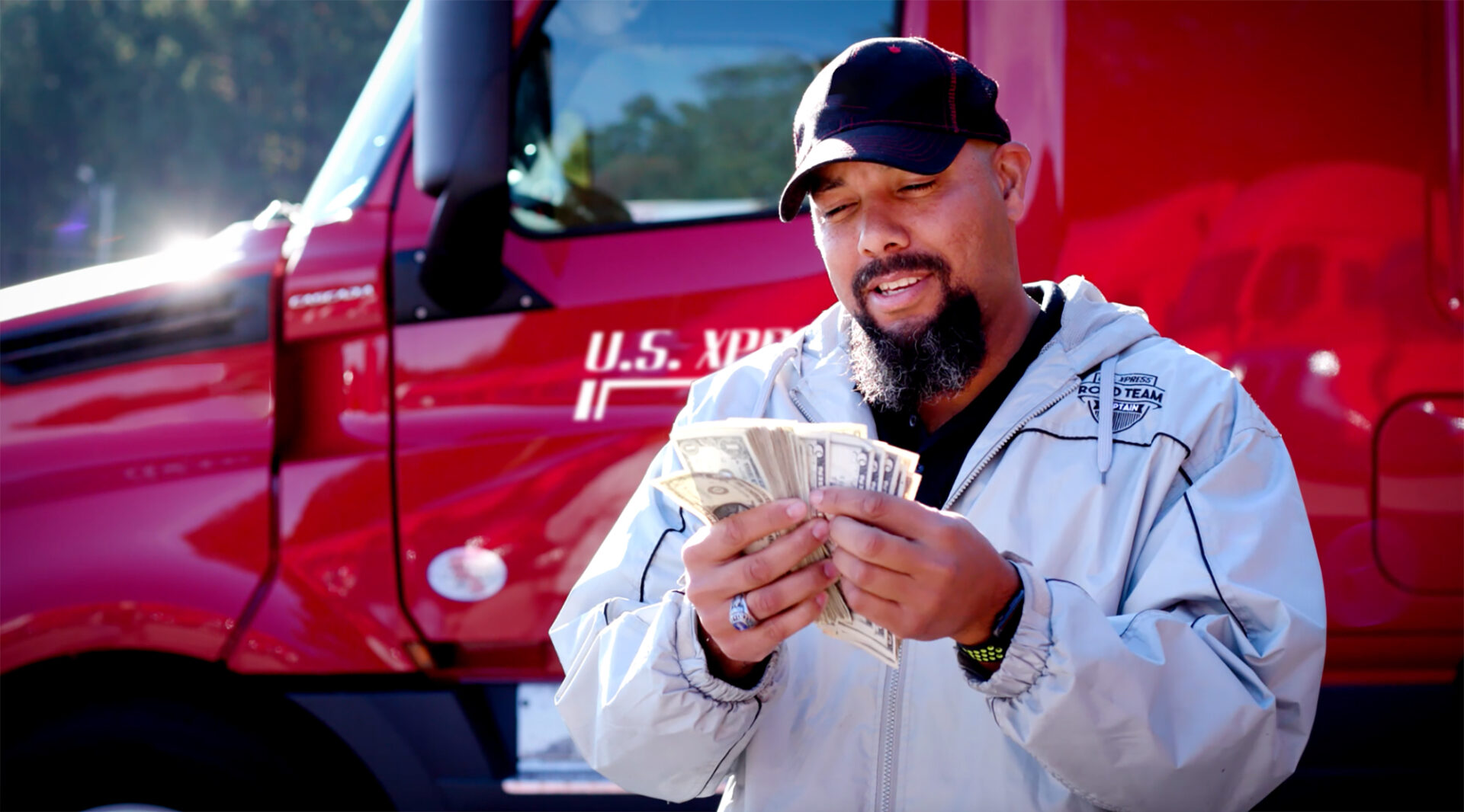 USX_Make Money_Image couple of drivers in front of truck